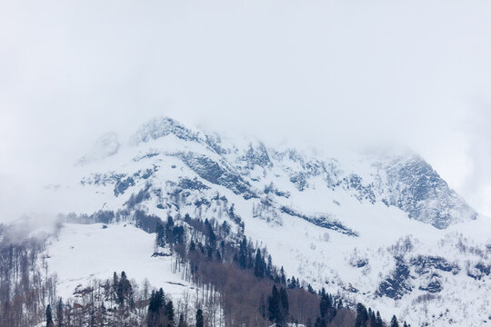 Snow blankets rugged mountain peaks