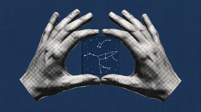 Human hands holding a square dark blue tile featuring glowing white celestial constellation star map patterns
