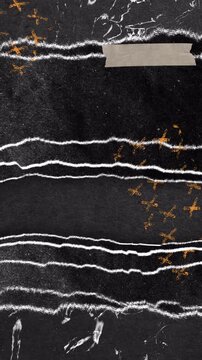 Abstract dark background with ripped paper layers and orange cross symbols.