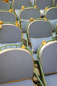 Empty Striped Bistro Chairs on Outdoor Restaurant Terrace