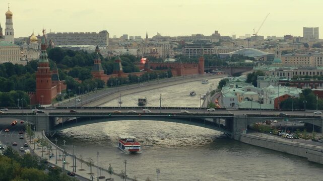 Central Moscow Skyline with Kremlin and River
Wide urban landscape showing the Moscow Kremlin, river traffic, bridges and busy roads through the city center.