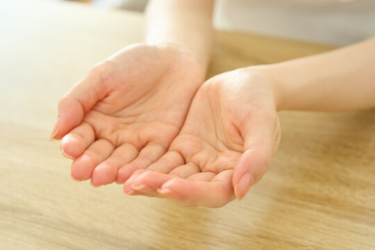 Young Womans Cupped Hands Offering With Gratitude