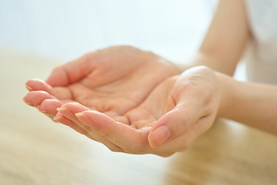 Young Womans Cupped Hands Offering With Gratitude