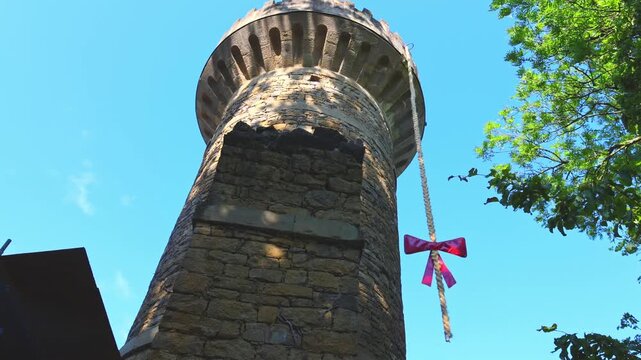 Animated Rapunzel figure pulls up her long braid from the Emichsburg Rapunzel Tower at Bl&uuml;hendes Barock in Ludwigsburg, Germany.