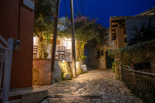 Traditional Stone Architecture and Outdoor Cafe Seating in Afionas Village Corfu Greece at Night