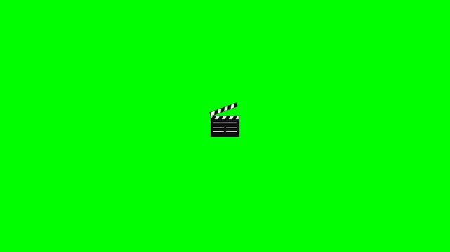 Small movie clapperboards clapping on green screen