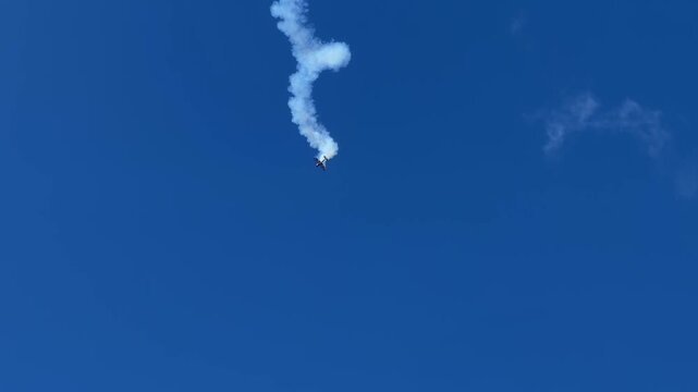 Stunt Plane Performing Aerobatics with Smoke Trail at Gold Coast Air Show