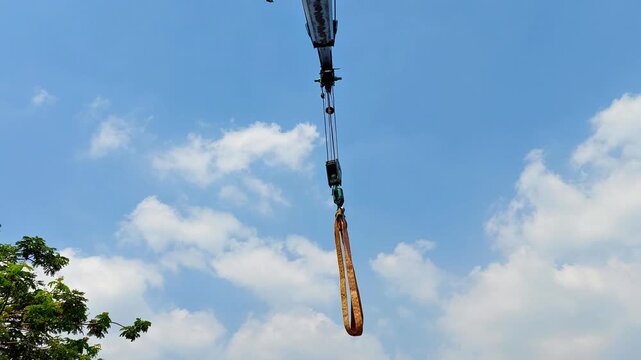 telescopic crane moving with blue sky background
