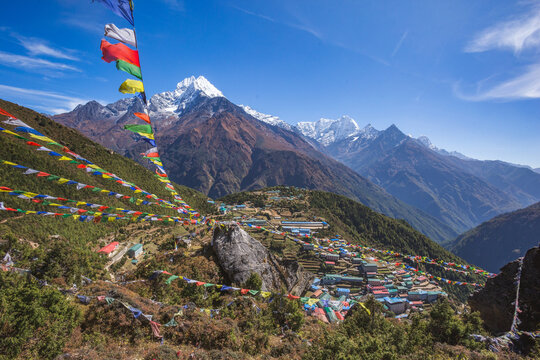 Prayer flags with Buddhist mantras. Namche Bazar village. Himalayan mountains, Nepal