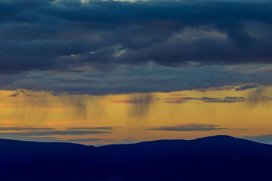 Misty Carpathian mountains at sunrise, Morning rainstorm approaching the Carpathian mountains