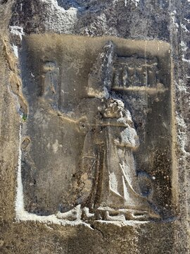 Ancient Stone Relief Carving of Figure on Temple Wall. Yazılıkaya was a sanctuary of Hattusa, the capital city of the Hittite Empire, today in the &Ccedil;orum Province, Turkey.