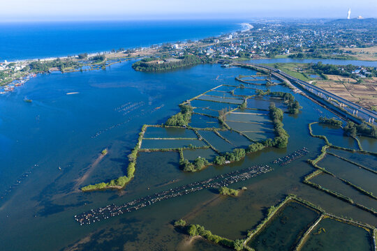 aerial view of aquaculture ponds and coastal landscape in Tinh Khe, Quang Ngai Province, Vietnam.