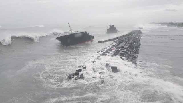 Aerial View Of Wrecked Ship Pounded By Rough Ocean Waves