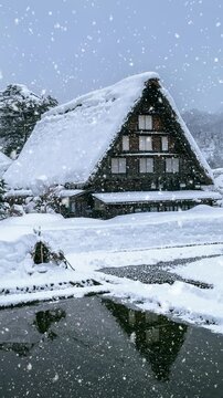 Snowfall in Shirakawago village in winter, UNESCO world heritage sites, Japan. Vertical.