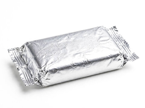 Rectangular food package wrapped in silver foil isolated on white background with foil wrapper wrapped product metallic pac