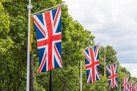 Row of British flags hanging along street in London