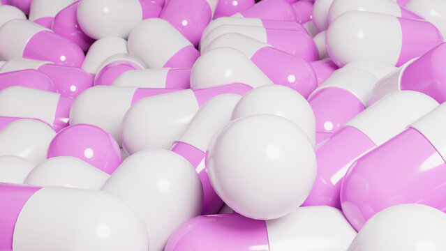 Pink and white pharmaceutical capsules pile closeup
