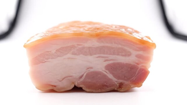 Fresh raw pork belly cut placed on a bright white