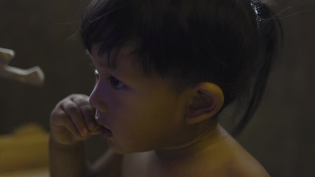Toddler Eating Biscuit Stick At Home
