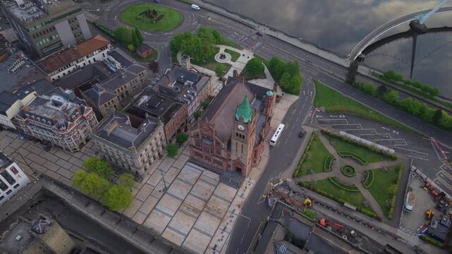 Aerial view of the historic Guildhall and surrounding urban landscape in Derry, United Kingdom.