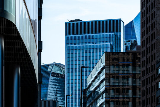 Modern office skyscrapers and glass architecture form a City of London cityscape where towers and buildings rise through the financial district