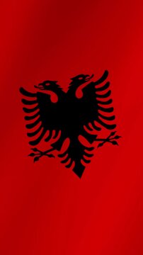 Albanian national flag waving in the wind. Detailed and high-quality fabric texture animation representing patriotism and national pride.