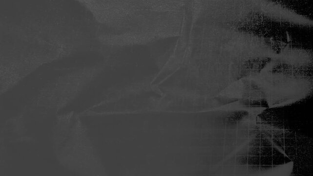 Abstract black and white texture of crumpled metallic foil with a grid pattern