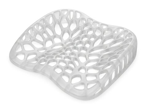 Abstract parametric 3d printed chair seat with organic voronoi cellular structure isolated on white background