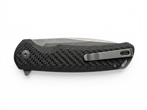Modern folding pocket knife with a textured carbon fiber handle and a stainless steel clip, isolated on white background
