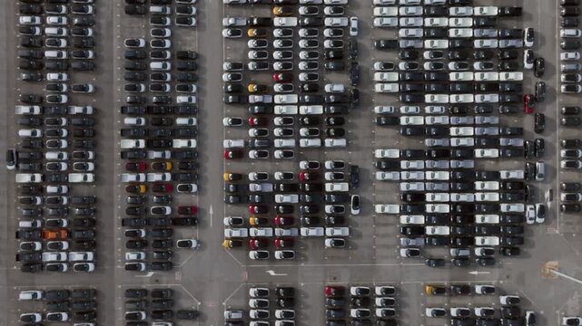Aerial view new car lined up, Automobile automotive car parking lot commercial business industry, Port of import export business logistic dealership, New cars global business logistic import export.