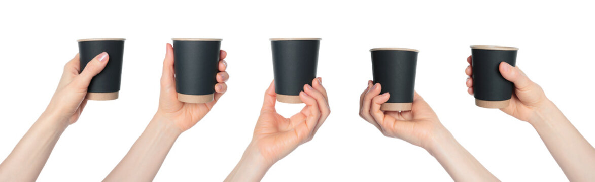 Hand holding a black paper coffee cup. Clean studio lighting, texture, isolated on transparent background. Perfect for branding, packaging, and advertising use