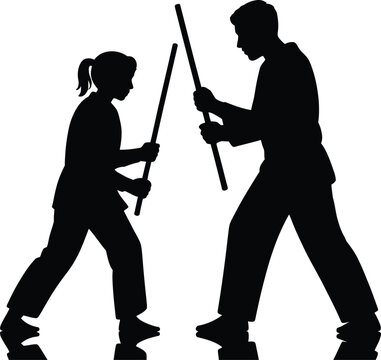 Silhouette of martial arts instructor and student practicing stick fighting techniques together during training session