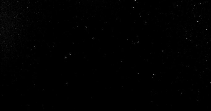 Ultra slow motion falling water droplets isolated on a black background creating a realistic rain VFX overlay. Perfect for cinematic compositing visual effects and motion graphic.