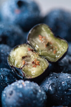 Fresh blueberries with one cut berry macro close up. Macro.