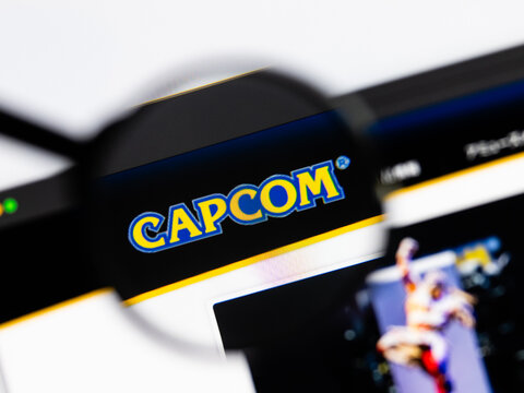 Milan, Italy 2026, 15 AGO Closeup of Capcom website page on a laptop screen. Focus on Capcom logo under a magnifying glass.