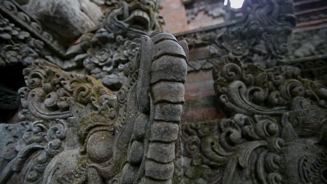 Detailed View of Weathered Stone Naga Statue in Sacred Monkey Forest