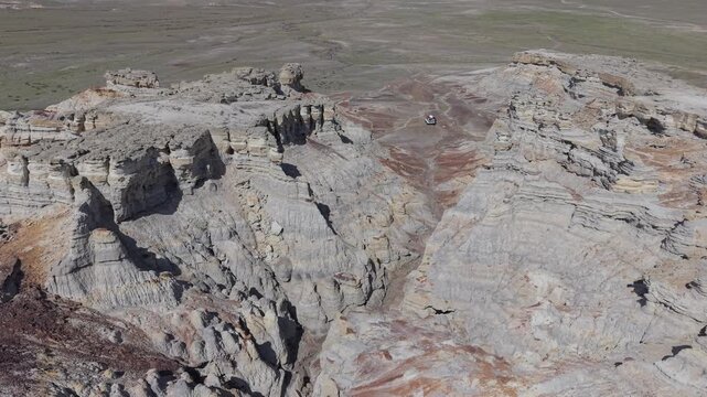 Aerial view of the rugged and eroded rock formations of the Mangystau Safari landscape in Aktau, Mangystau Region, Kazakhstan.