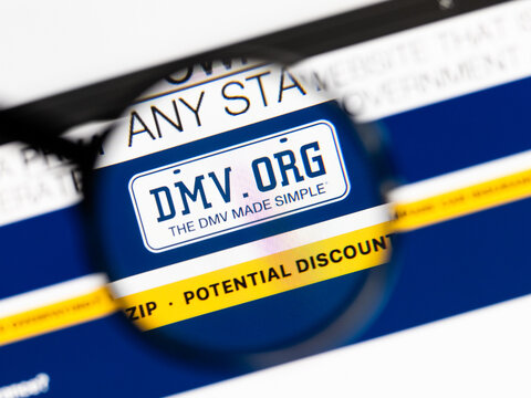 Milan, Italy 2026, 15 AGO Closeup of dmv website page on a laptop screen. Focus on dmv logo under a magnifying glass.