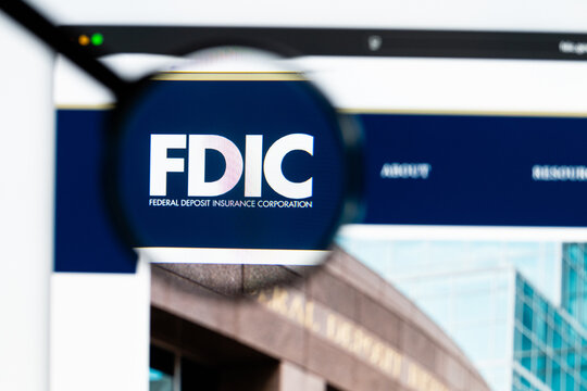 Milan, Italy 2026, 15 AGO Closeup of Federal Deposit Insurance Corporation FDIC website page on a laptop screen. Focus on Federal Deposit Insurance Corporation FDIC logo under a magnifying glass.