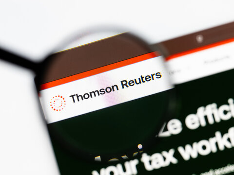 Milan, Italy 2026, 15 AGO Closeup of Thomson Reuters website page on a laptop screen. Focus on Thomson Reuters logo under a magnifying glass.