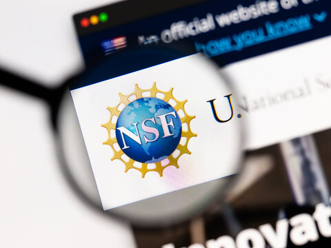 Milan, Italy 2026, 15 AGO Closeup of National Science Foundation NSF website page on a laptop screen. Focus on National Science Foundation NSF logo under a magnifying glass.