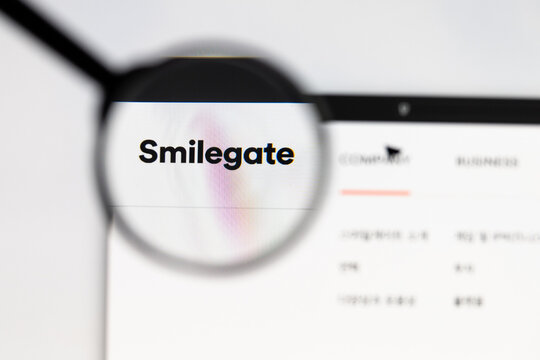 Milan, Italy 2026, 15 AGO Closeup of Smilegate website page on a laptop screen. Focus on Smilegate logo under a magnifying glass.