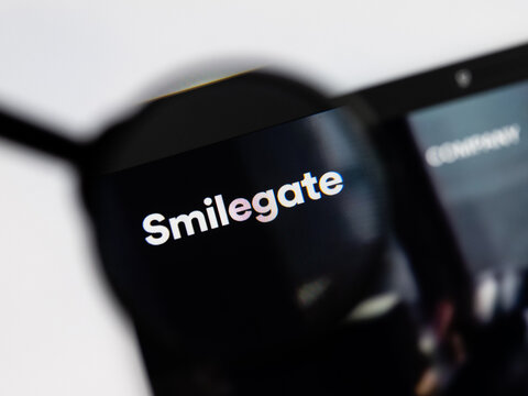Milan, Italy 2026, 15 AGO Closeup of Smilegate website page on a laptop screen. Focus on Smilegate logo under a magnifying glass.