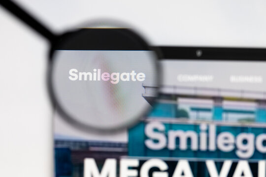 Milan, Italy 2026, 15 AGO Closeup of Smilegate website page on a laptop screen. Focus on Smilegate logo under a magnifying glass.