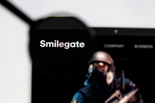 Milan, Italy 2026, 15 AGO Closeup of Smilegate website page on a laptop screen. Focus on Smilegate logo under a magnifying glass.