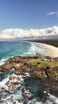 Drone flight along Hastings Point beach and the Tweed Coast shoreline, NSW Australia - vertical video