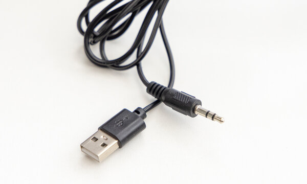 Black USB to audio jack adapter cable isolated