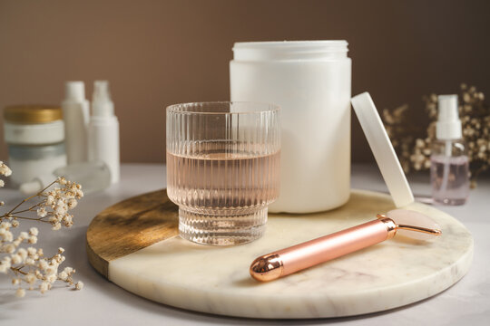 Collagen supplement with skincare accessories and beauty wellness concept
