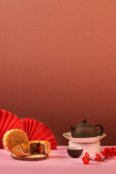 Traditional mooncakes and tea set with copy space for Mid-Autumn Festival concept