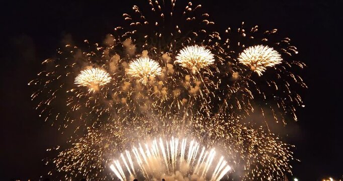 Gold fireworks on black background. 4K Video 60 fps